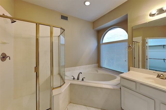 bathroom with tile patterned floors, vanity, and plus walk in shower