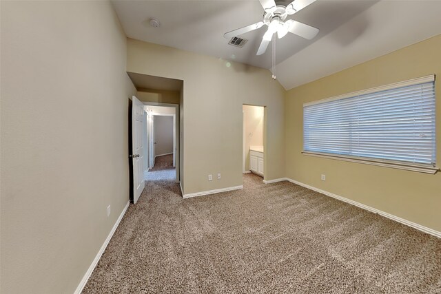 unfurnished bedroom with light carpet, ensuite bath, ceiling fan, and lofted ceiling