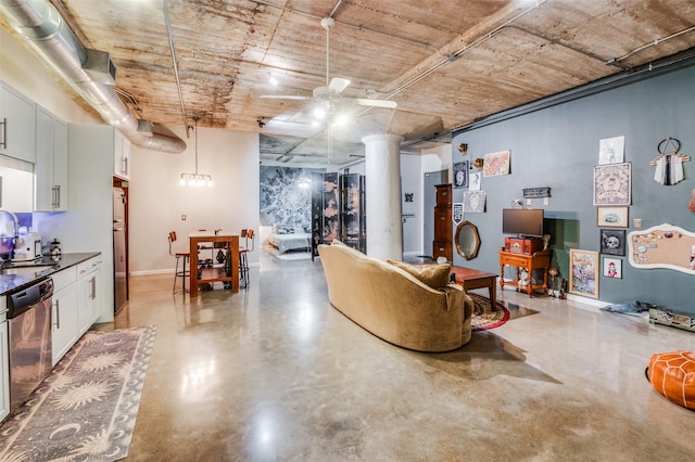 interior space featuring ceiling fan and concrete floors