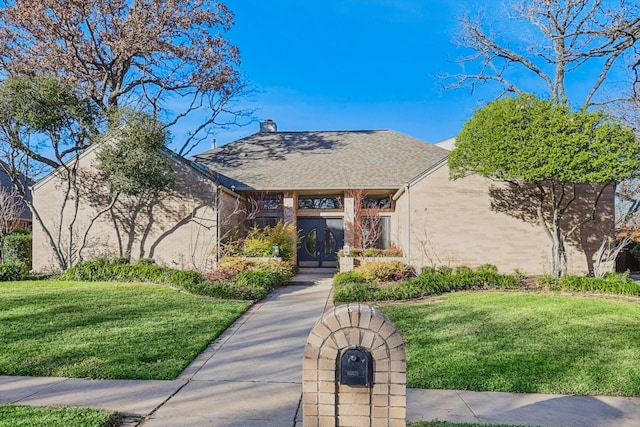 view of front of home with a front yard