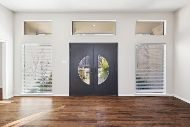 entrance foyer featuring french doors and dark hardwood / wood-style floors