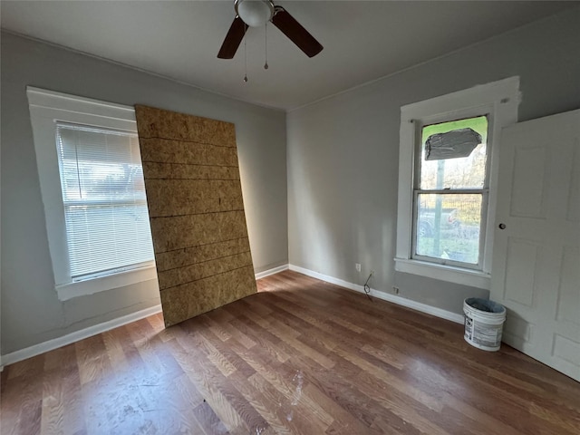 empty room featuring hardwood / wood-style flooring and ceiling fan