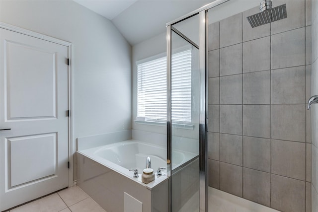 bathroom featuring tile patterned floors, independent shower and bath, and lofted ceiling