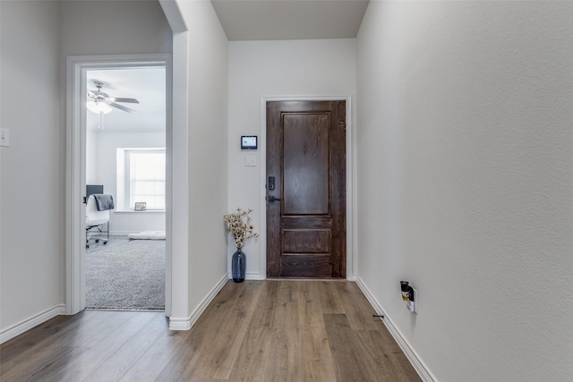 hall with light hardwood / wood-style floors