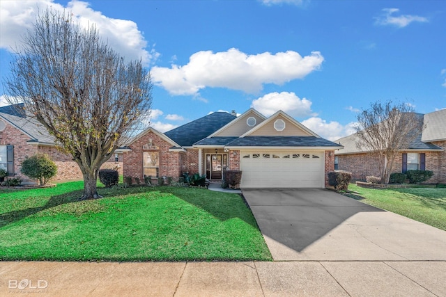 view of front of home featuring a front yard and a garage