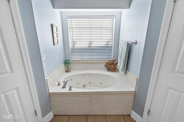 bathroom featuring tile patterned floors and a washtub