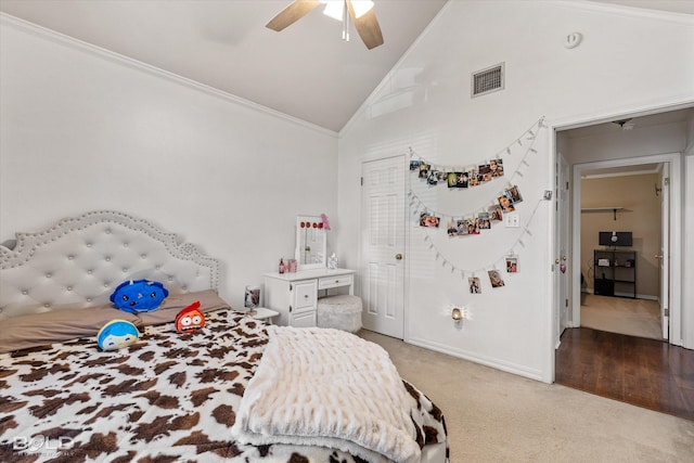 carpeted bedroom with ceiling fan, ornamental molding, and high vaulted ceiling