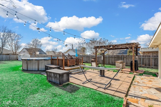 view of yard with a pergola, a patio, and a covered pool