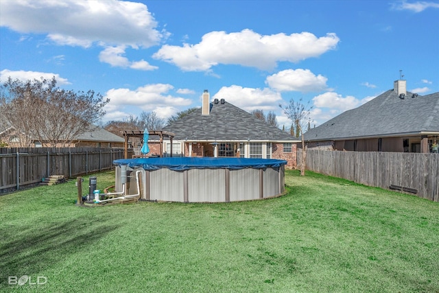 view of yard featuring a covered pool