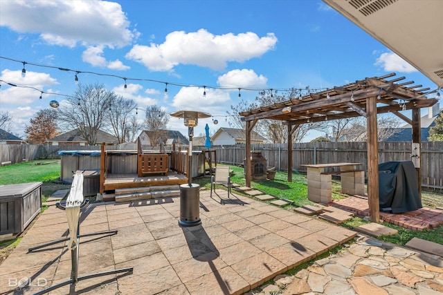 view of patio with a pergola and a grill