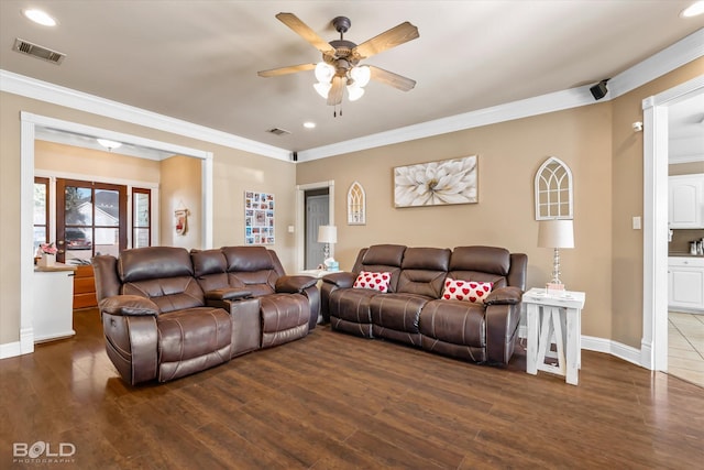 living room with dark hardwood / wood-style flooring, ceiling fan, and ornamental molding