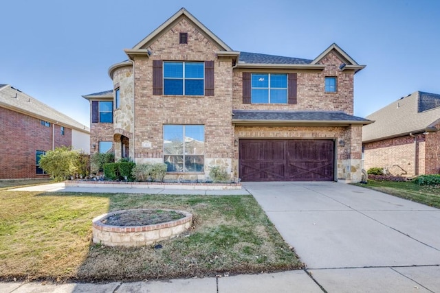 view of front of property with a garage and a front lawn