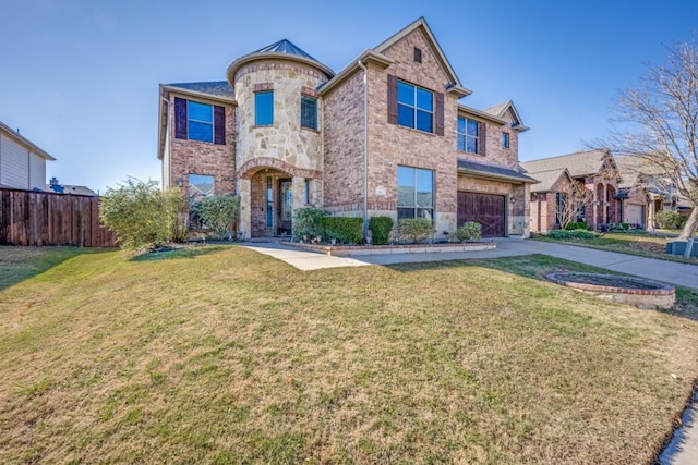 view of front of property featuring stone siding, a front yard, fence, and driveway