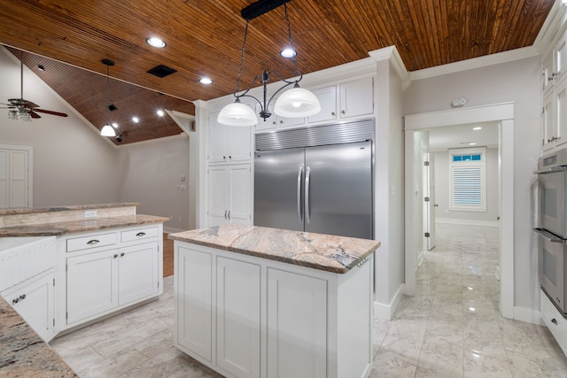 kitchen featuring pendant lighting, ceiling fan, a kitchen island, and wood ceiling