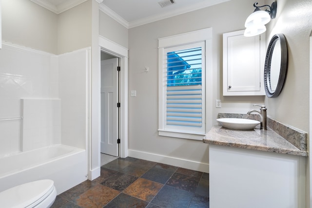 full bathroom featuring crown molding, vanity, bathtub / shower combination, and toilet