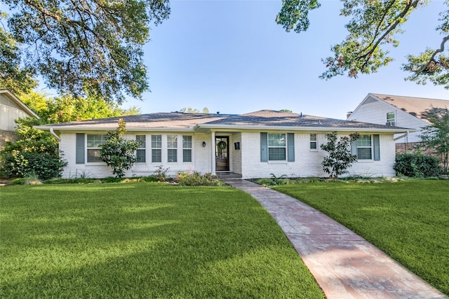 ranch-style house with a front lawn