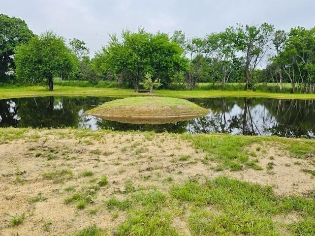 surrounding community with a water view