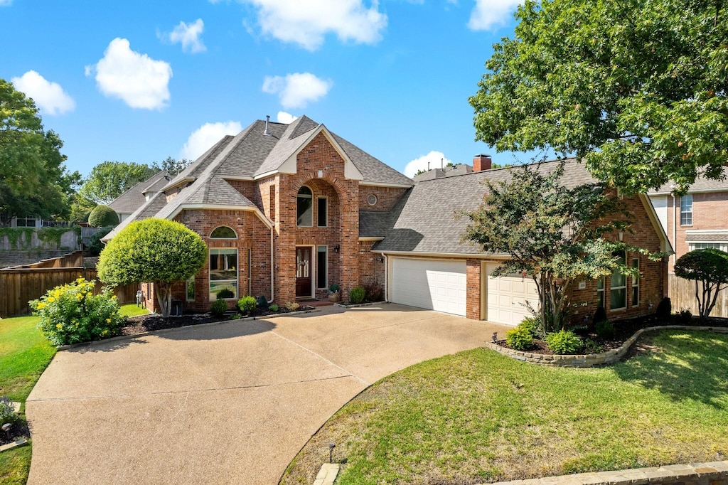 front of property with a garage and a front yard