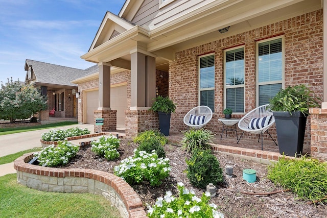 exterior space featuring covered porch and a garage