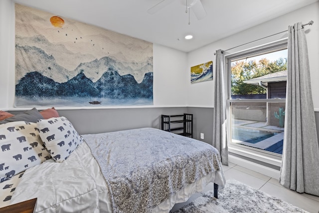 bedroom with ceiling fan and light tile patterned floors