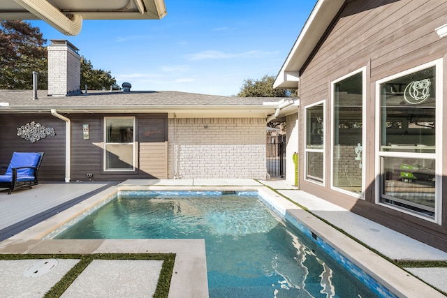 view of pool featuring a wooden deck