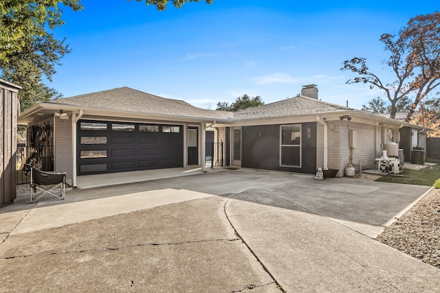 single story home with a garage