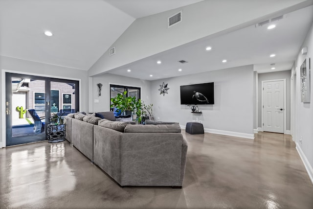 living room with french doors, high vaulted ceiling, and concrete flooring