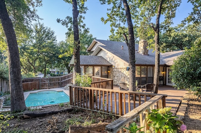 view of swimming pool featuring a wooden deck