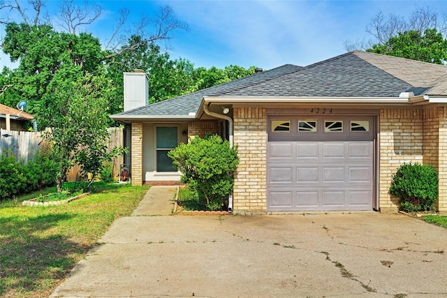 ranch-style house featuring a garage