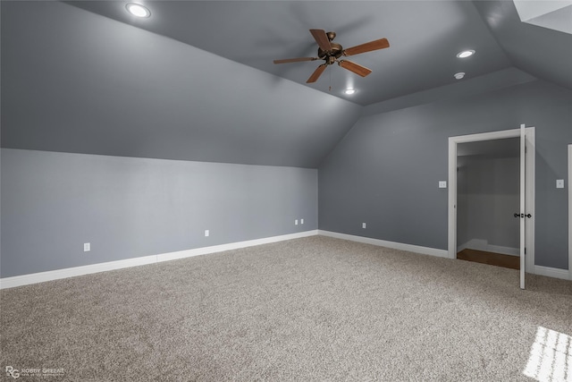 additional living space with carpet flooring, ceiling fan, and lofted ceiling