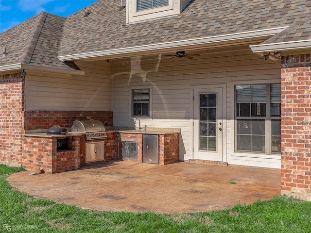 view of patio / terrace with area for grilling and sink