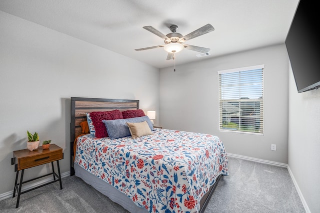 bedroom with dark carpet and ceiling fan