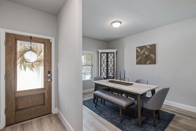 dining room with light hardwood / wood-style flooring