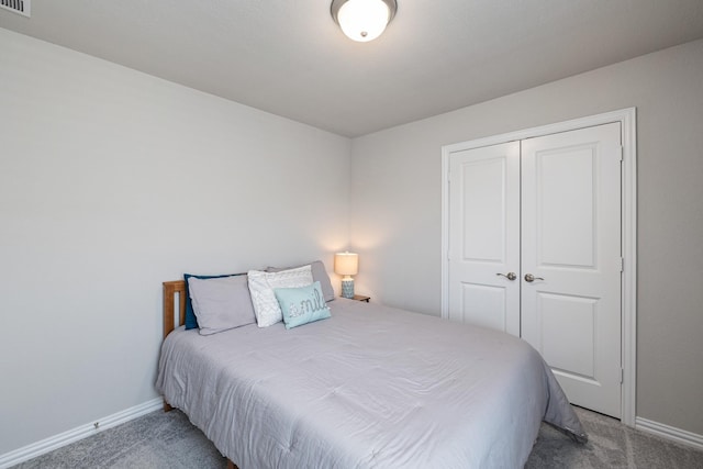 carpeted bedroom featuring a closet