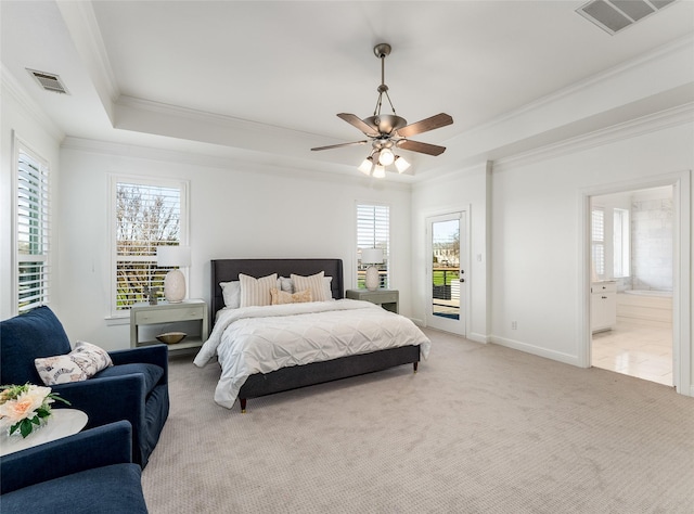 bedroom featuring access to outside, a raised ceiling, ceiling fan, connected bathroom, and light colored carpet