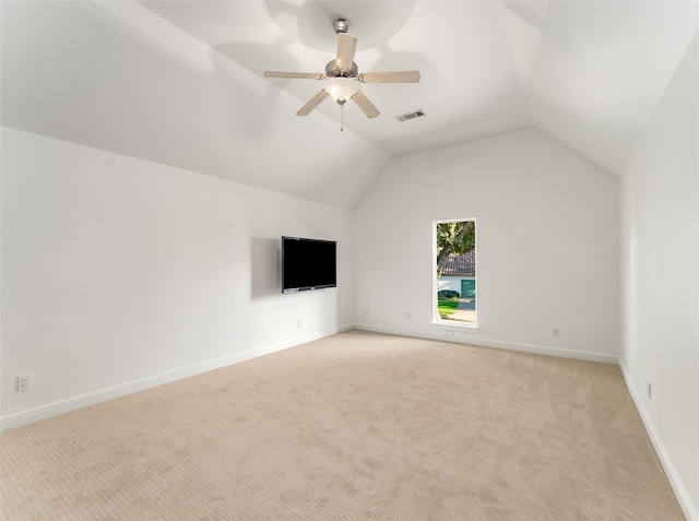 unfurnished living room featuring light colored carpet, ceiling fan, and lofted ceiling