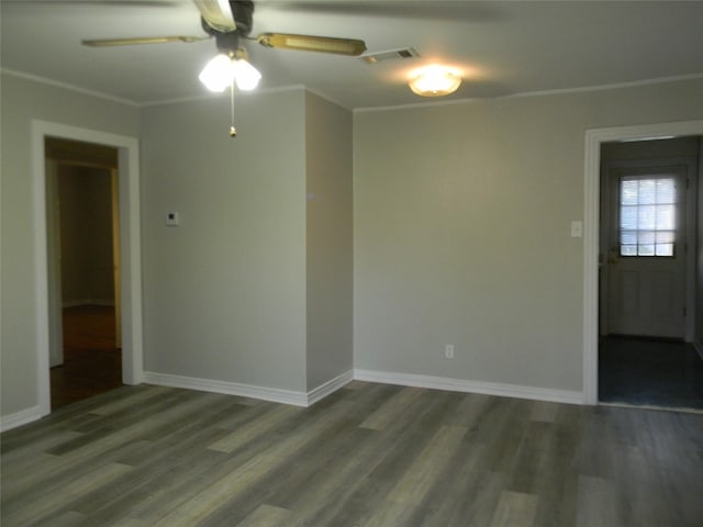 unfurnished room featuring ornamental molding, ceiling fan, and dark wood-type flooring