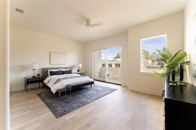 bedroom featuring ceiling fan, light hardwood / wood-style floors, and access to exterior