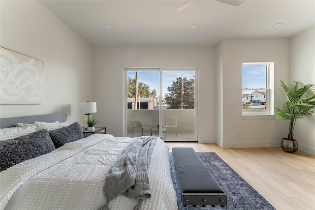 bedroom featuring hardwood / wood-style floors and access to outside