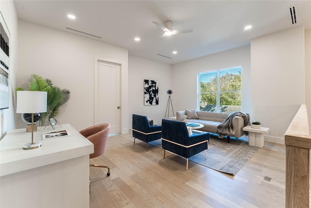 office with ceiling fan and light wood-type flooring