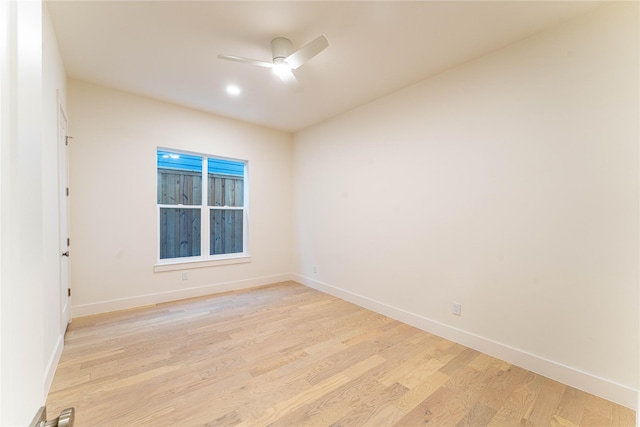 empty room featuring ceiling fan and light wood-type flooring