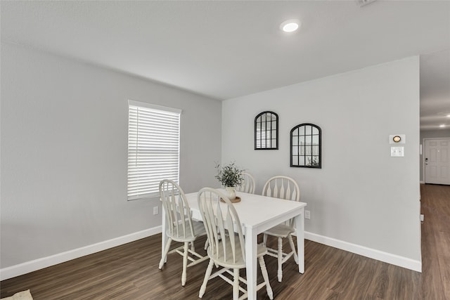 dining area with dark wood-type flooring