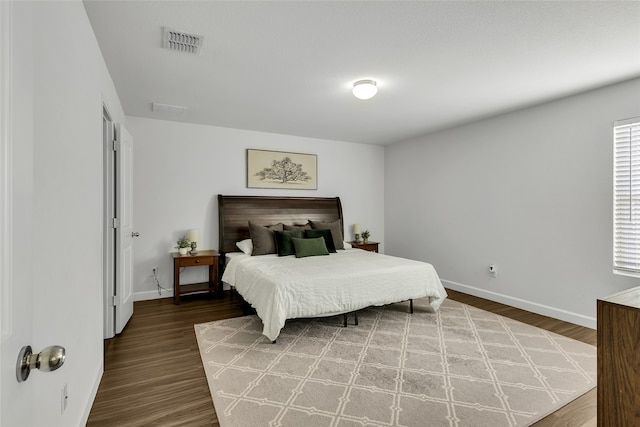 bedroom featuring wood-type flooring