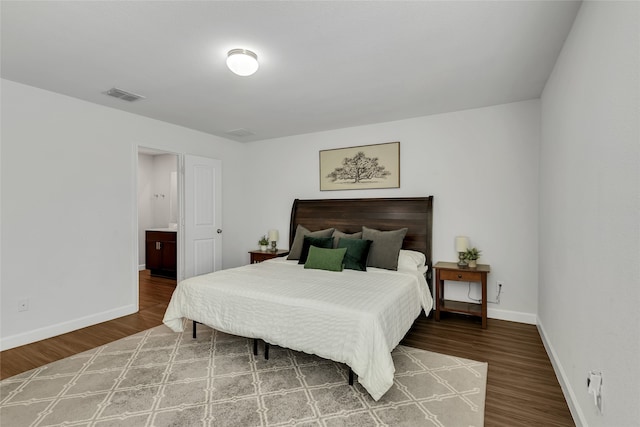 bedroom with hardwood / wood-style floors