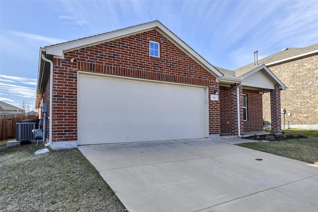 view of front of property with central AC unit and a garage