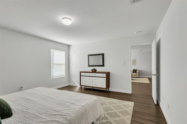 bedroom featuring dark hardwood / wood-style flooring