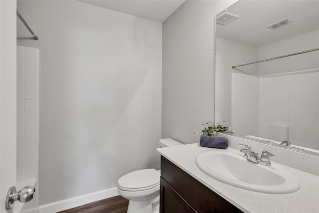 bathroom featuring hardwood / wood-style floors, vanity, and toilet