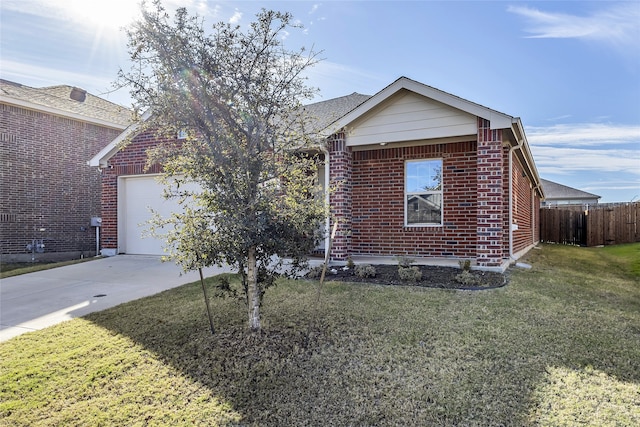 view of front of house featuring a garage and a front lawn