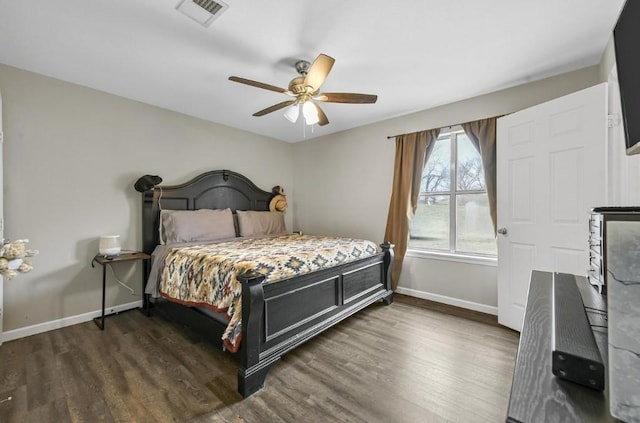 bedroom featuring ceiling fan and dark hardwood / wood-style flooring