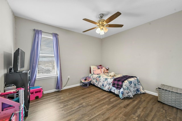 bedroom with ceiling fan and dark hardwood / wood-style flooring